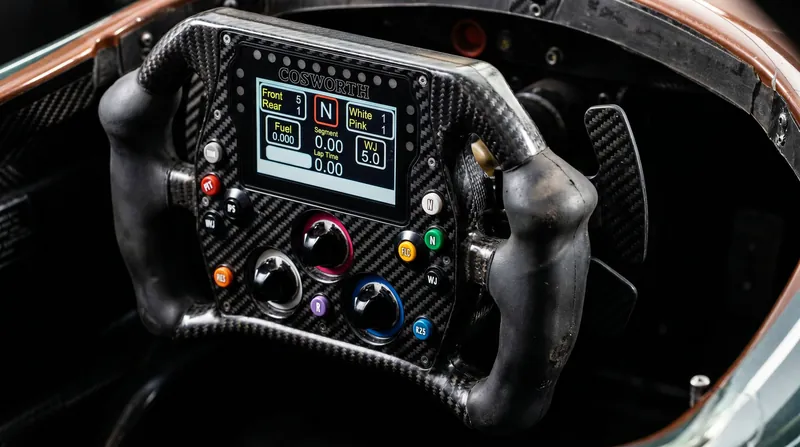 IndyCar steering wheels lack power assist, transferring immense kickback forces directly to the driver's hands.
