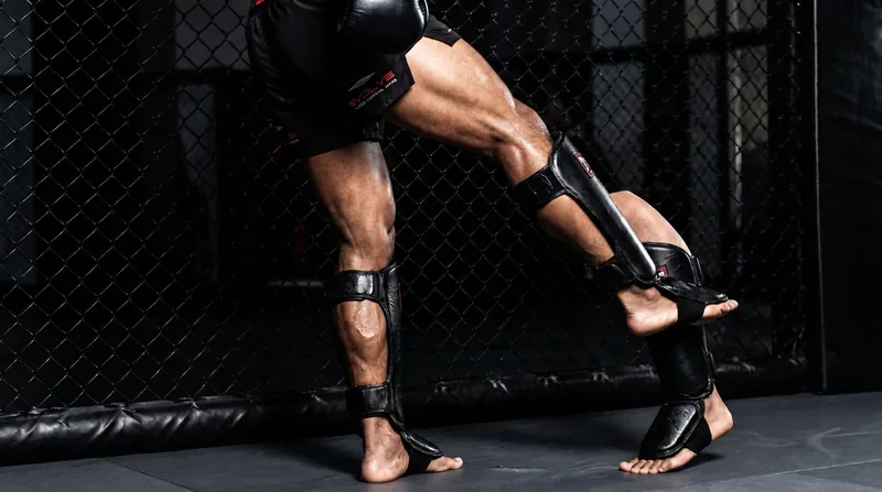 Checking a calf kick requires a painful outward rotation of the shin, meeting the attacker's strike bone-on-bone.