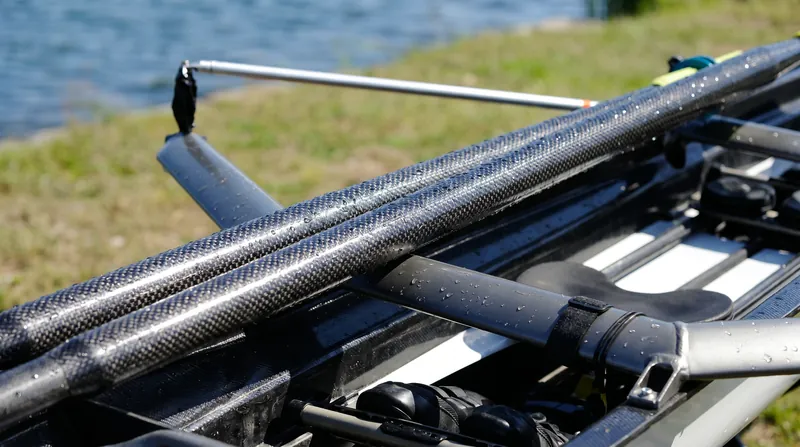 While carbon fiber equipment has made boats faster, medical experts note its rigidity transfers significantly more shock to the athlete's spine.