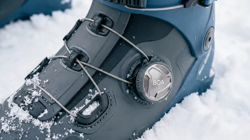 The BOA Fit System uses micro-adjustable steel cables to wrap the boot shell, replacing traditional buckles.