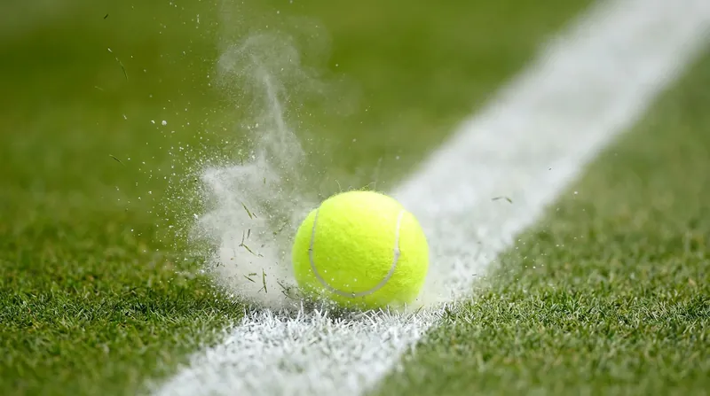 The optical tracking system calculates the ball's exact landing spot with millimeter precision, eliminating human error.