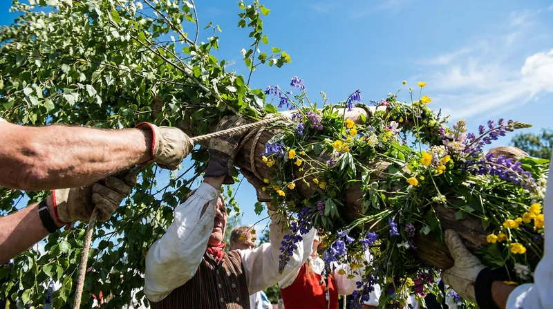 Decorating and raising the maypole requires a coordinated community effort.