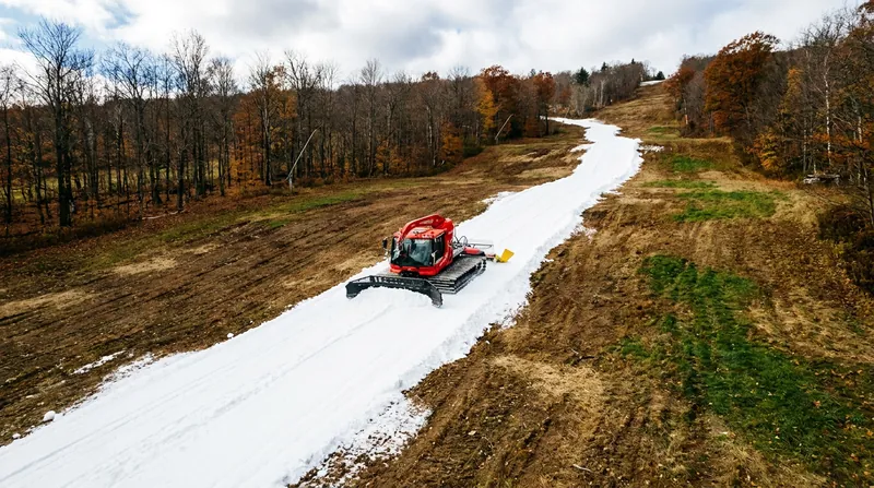 In autumn, the insulated snow is uncovered and spread to form a guaranteed base layer before natural snowfall arrives.