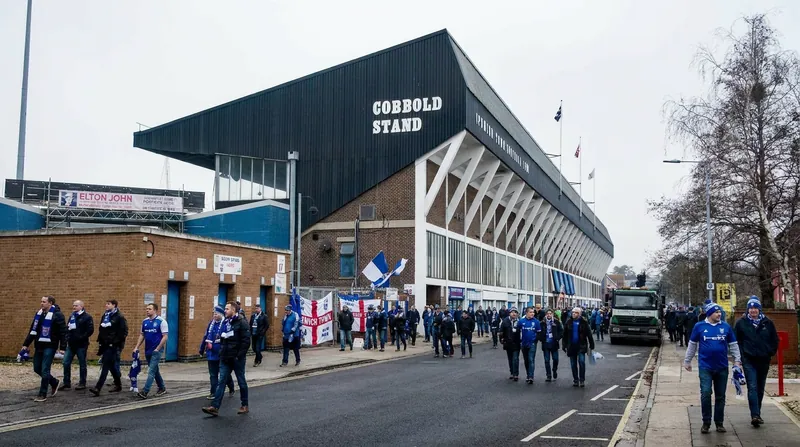 Supporters gather outside Portman Road following the announcement of the new managerial appointment.