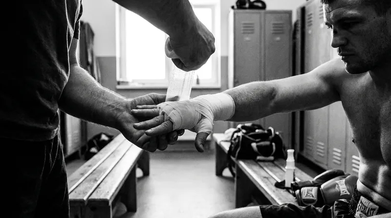 Proper hand wrapping is essential, but modern sports science suggests the glove itself must provide structural wrist support.