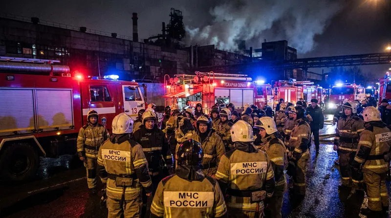 Russian emergency services respond to the aftermath of the drone strikes in the southern Urals.