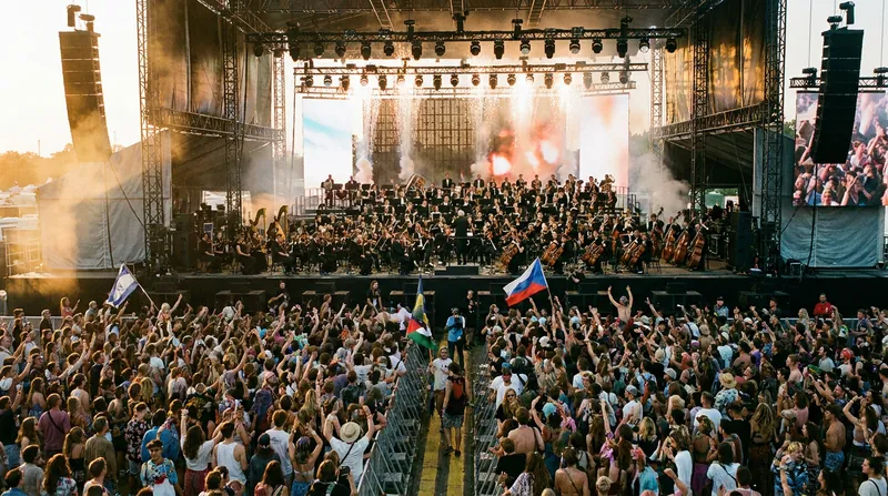 Major orchestras are increasingly stepping outside traditional concert halls to perform at contemporary music festivals.