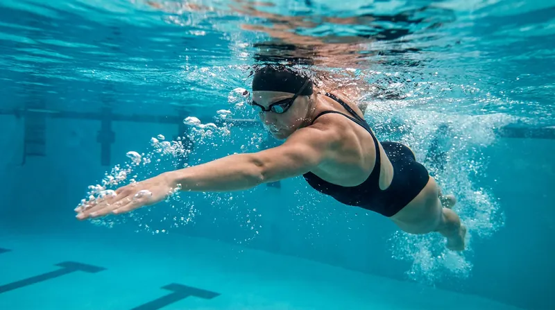By increasing resistance, swimmers are forced to eliminate 'dead spots' in their stroke, improving propulsive continuity.