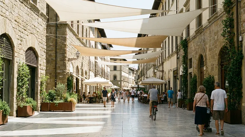 Cities like Toulouse are testing modular shading structures in historic plazas where planting trees is structurally impossible.