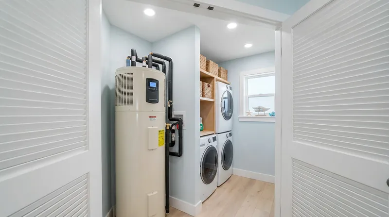 Heat pump water heaters require specific air-volume clearances, forcing architects to rethink utility closet designs.
