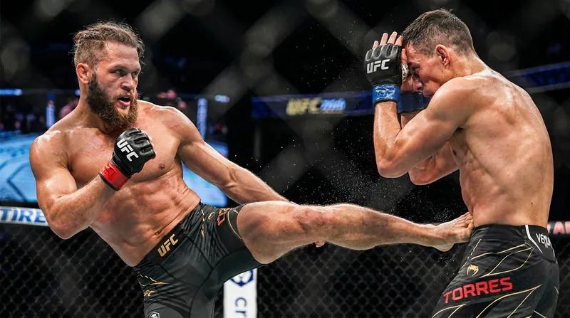 The first round was a tactical chess match, with Torres pressing forward and Fiziev utilizing low kicks.