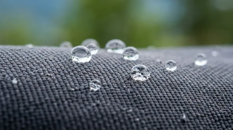 Without fluorocarbons, modern face fabrics rely on heat activation to maintain their water-shedding surface tension.