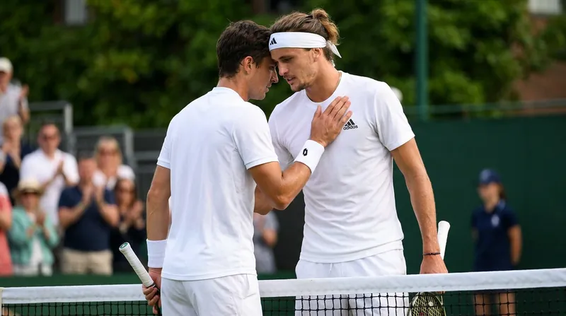 Matteo Berrettini and Stan Wawrinka share a warm embrace at the net following their epic first-round match.