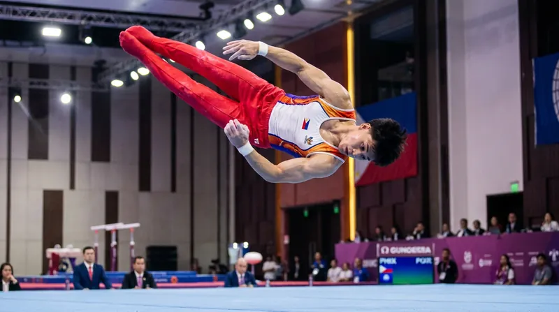 High-impact landings on the floor exercise place immense stress on the ankles and knees, requiring strict pain management.