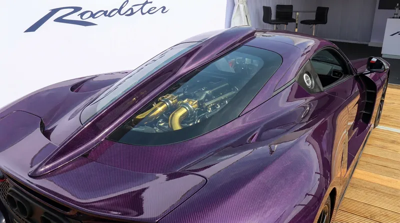 A 55-inch dorsal fin provides high-speed stability, bridging a glass cover that exposes the 6.6-liter 'Fury' V8.