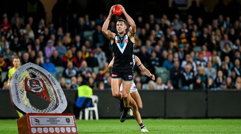 Port Adelaide ground out a physical 21-point victory over North Melbourne to stay in touch with the top ten.
