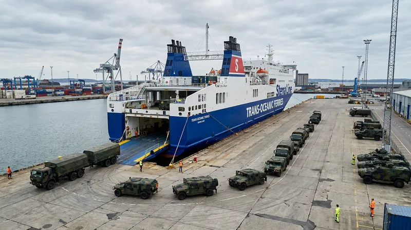 Defense analysts warn that heavy tanks could be transported across the strait via civilian ferries in a second-wave assault.