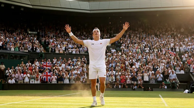 Fery acknowledges the home crowd after his breakthrough fortnight at the All England Club.