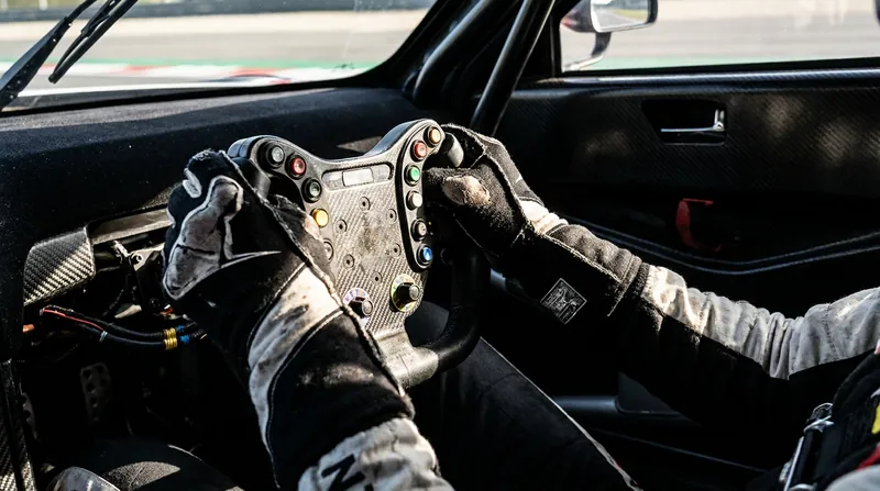 Even minor wrist injuries drastically complicate the heavy steering required in modern stock cars.