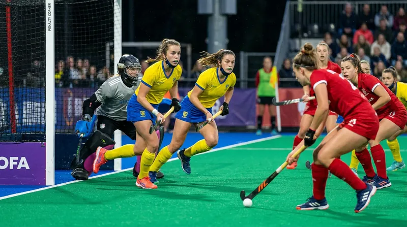 Austria capitalized on late penalty corners to secure their comeback victory.