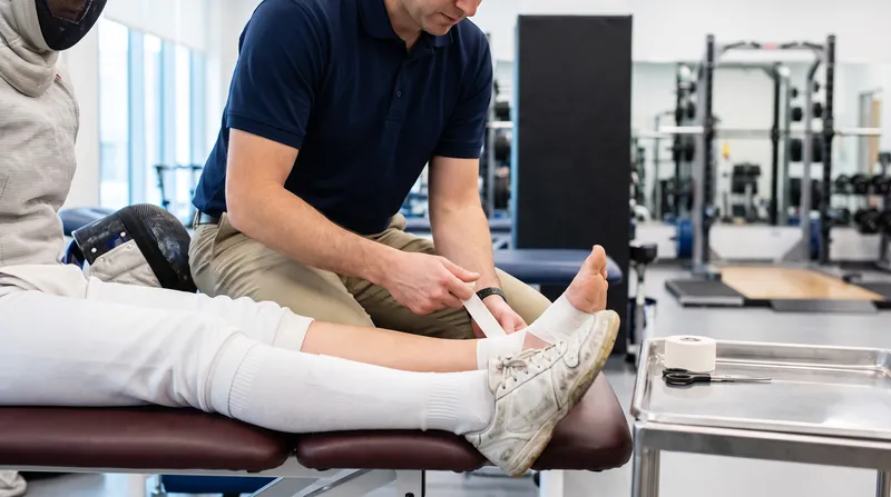Real-time biomechanical adjustments and preventative taping are critical for fencers managing cumulative physical stress.