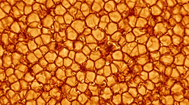 The newly observed 20-kilometer vortices act as microscopic mixing bowls, churning the Sun's magnetized plasma.