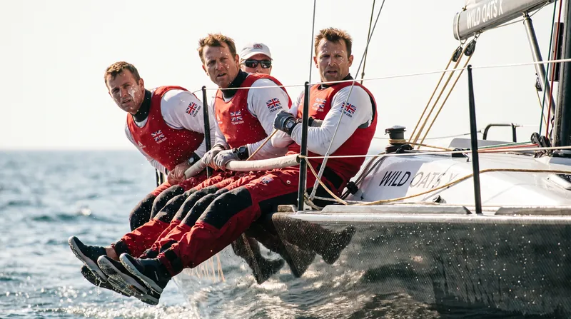 Crew coordination and physical fitness are critical to maintaining speed in the strict one-design class.