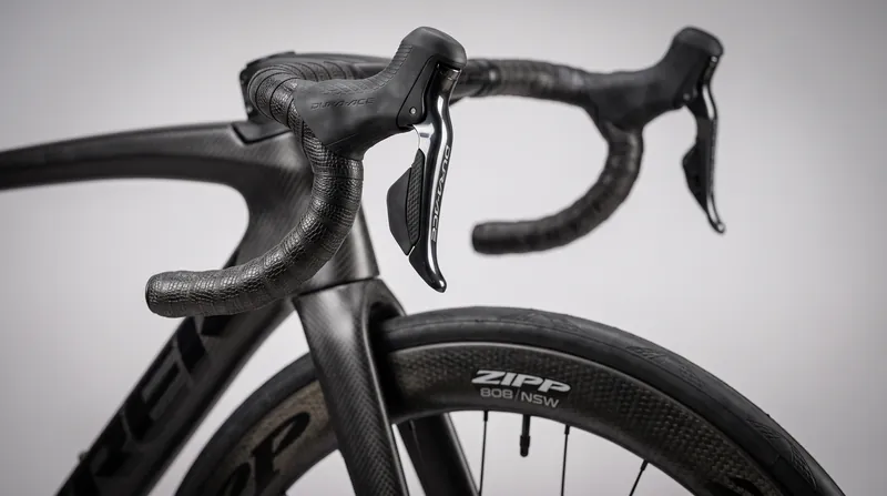 Aerodynamic setups like inward-tilted brake hoods and ultra-narrow bars are heavily restricted under the new rules.