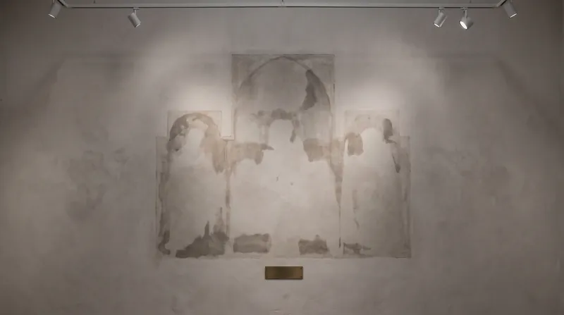 The empty gallery wall where the San Gregorio Polyptych hung before the theft.