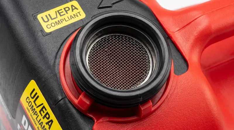 A compliant fuel container features a visible metallic or plastic mesh screen designed to prevent flame jetting.