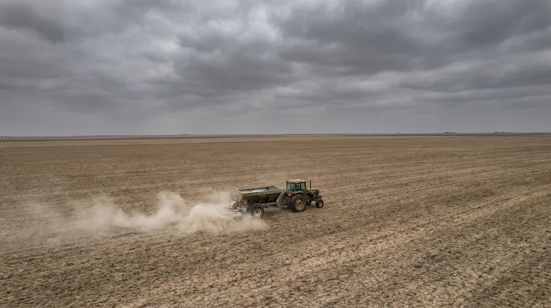 Farmers worldwide are being forced to reduce fertilizer application rates as prices for urea and ammonia surge.