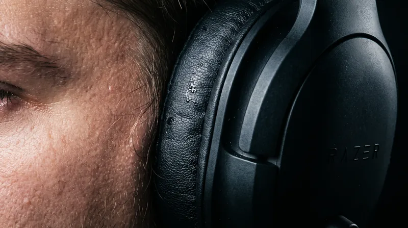 Gaming headsets and large over-ear monitors present a larger surface area for potential chemical transfer during prolonged use.