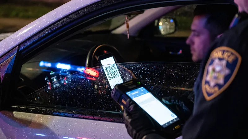 Handing an unlocked smartphone to law enforcement during a traffic stop creates complex Fourth Amendment risks.