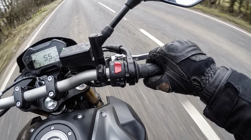A deliberate push on the inside handlebar is the fastest way to initiate a swerve.