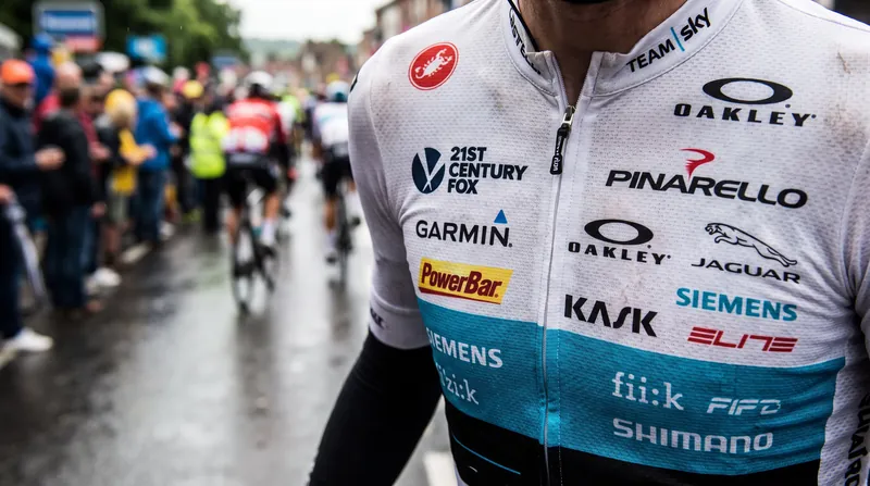 Without shared television revenue, teams operate as high-speed rolling billboards for corporate title sponsors.