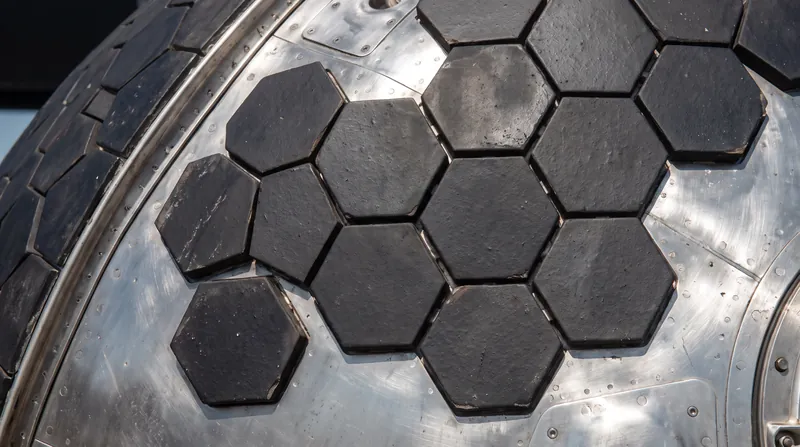 Roughly 18,000 hexagonal tiles protect Starship's windward side from the extreme heat of atmospheric compression.