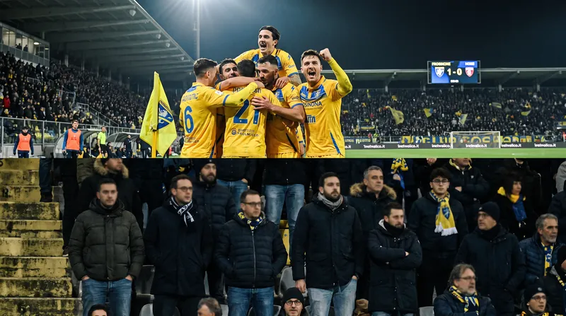 Frosinone players celebrate during their stunning 3-0 upset over Fiorentina at the Stadio Artemio Franchi.