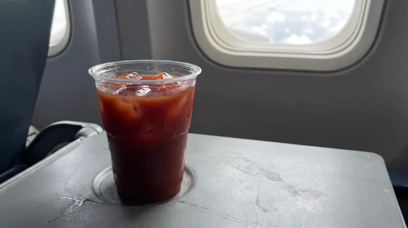 Tomato juice remains a staple of in-flight catering because its umami flavor profile is largely unaffected by the cabin's low pressure and dry air.