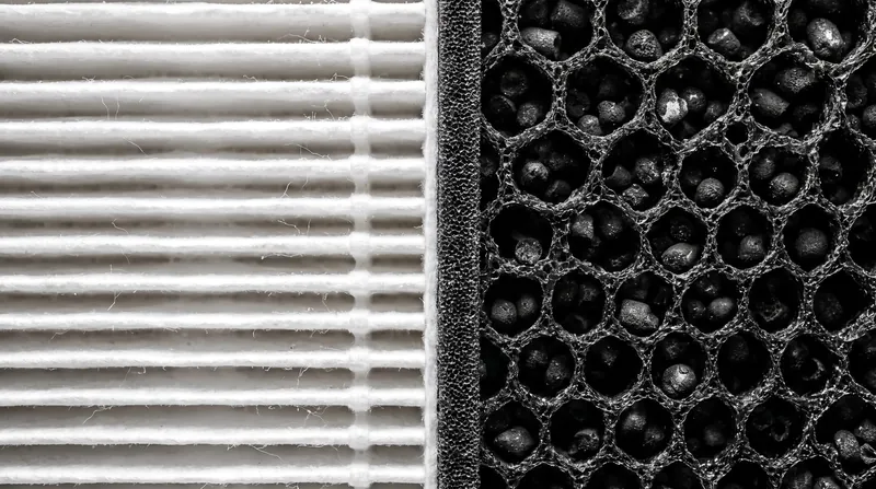 A hybrid approach using both HEPA and activated carbon is required to capture both solid particles and gaseous chemicals.