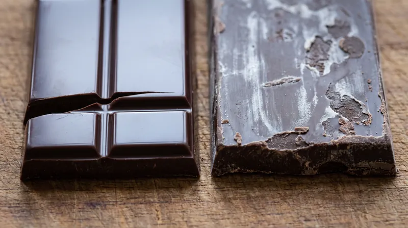 When chocolate is not properly tempered, unstable crystals migrate to the surface, resulting in the dull, streaky appearance known as fat bloom.