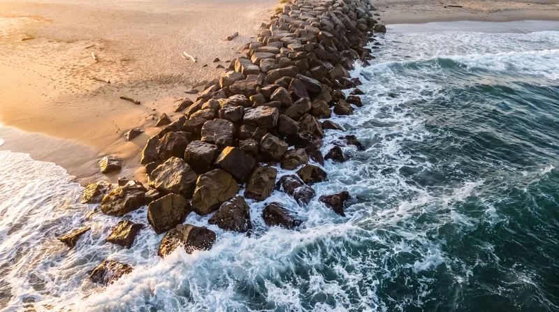 The 'sawtooth' effect: groynes successfully build up the beach on their updrift side at the expense of the downdrift shore.