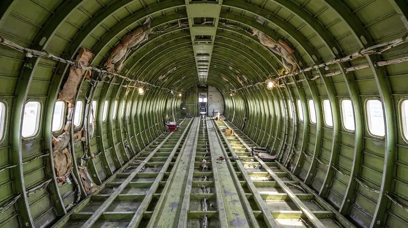 During a D-check, the entire passenger cabin is removed to allow engineers to inspect the bare metal skin for fatigue.