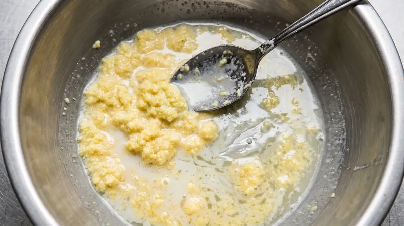 When temperatures exceed 185°F, the proteins bond too tightly and squeeze out water, resulting in a curdled sauce.