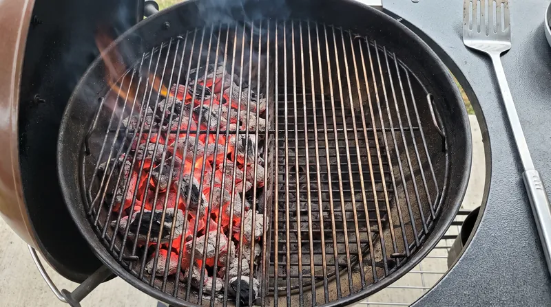 A two-zone fire allows cooks to manage radiant heat, moving food away from intense infrared radiation once the crust forms.