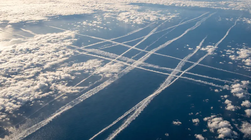 Ship tracks visible from space demonstrate how particulate exhaust physically alters cloud formation.