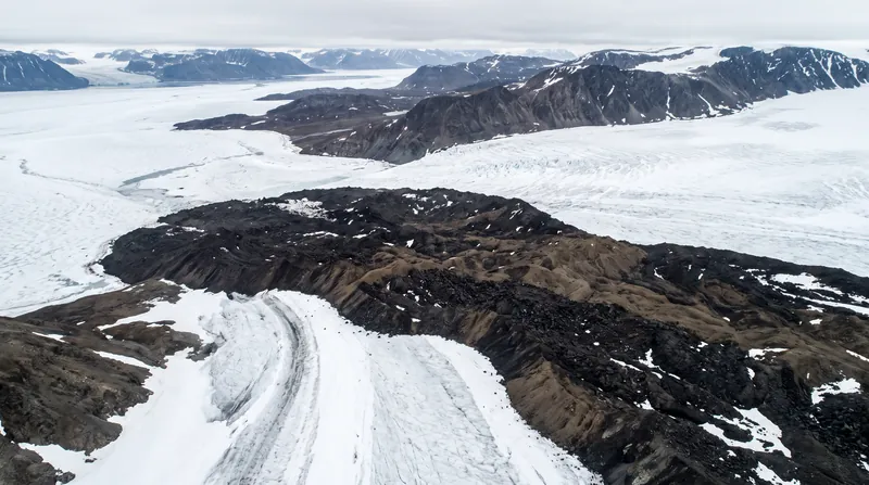 Debris from the earthquake-triggered rock avalanche blanketed the Kjerulf Glacier, fundamentally altering the landscape.