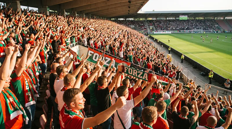 Traveling Augsburg supporters witnessed their club reach the Bundesliga summit for the first time.