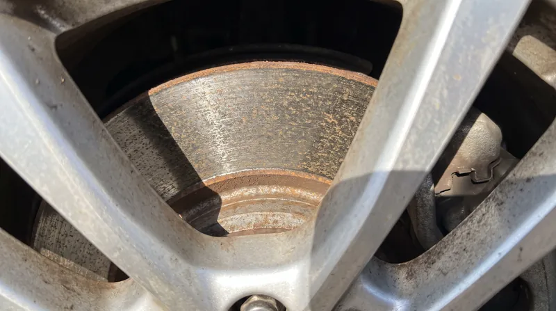 Infrequent use of the friction brakes can lead to surface rust on the rotors, a common maintenance quirk for EV owners.