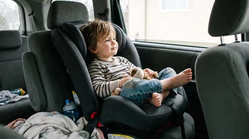 Toddlers have highly flexible joints and can comfortably sit with crossed legs in a rear-facing seat.