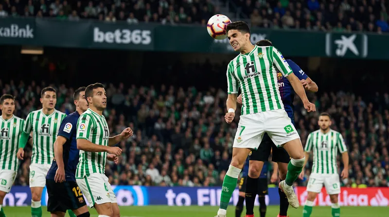 Marc Bartra scored twice from headers to keep Real Betis in the match.